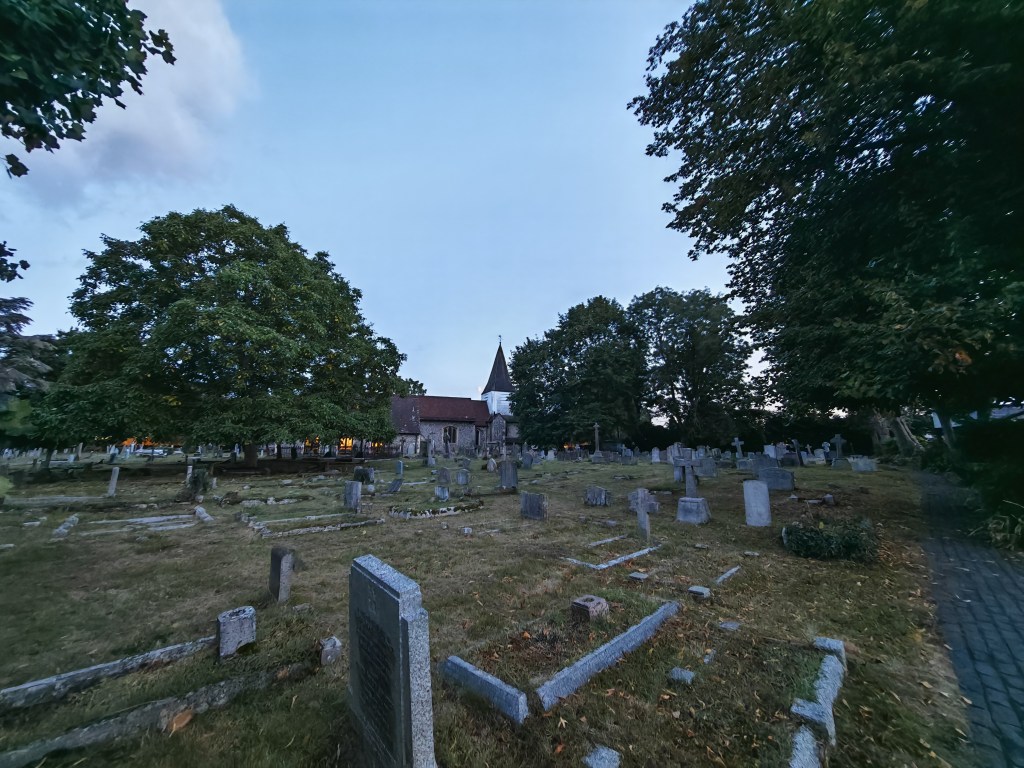 cemetery and church in low light