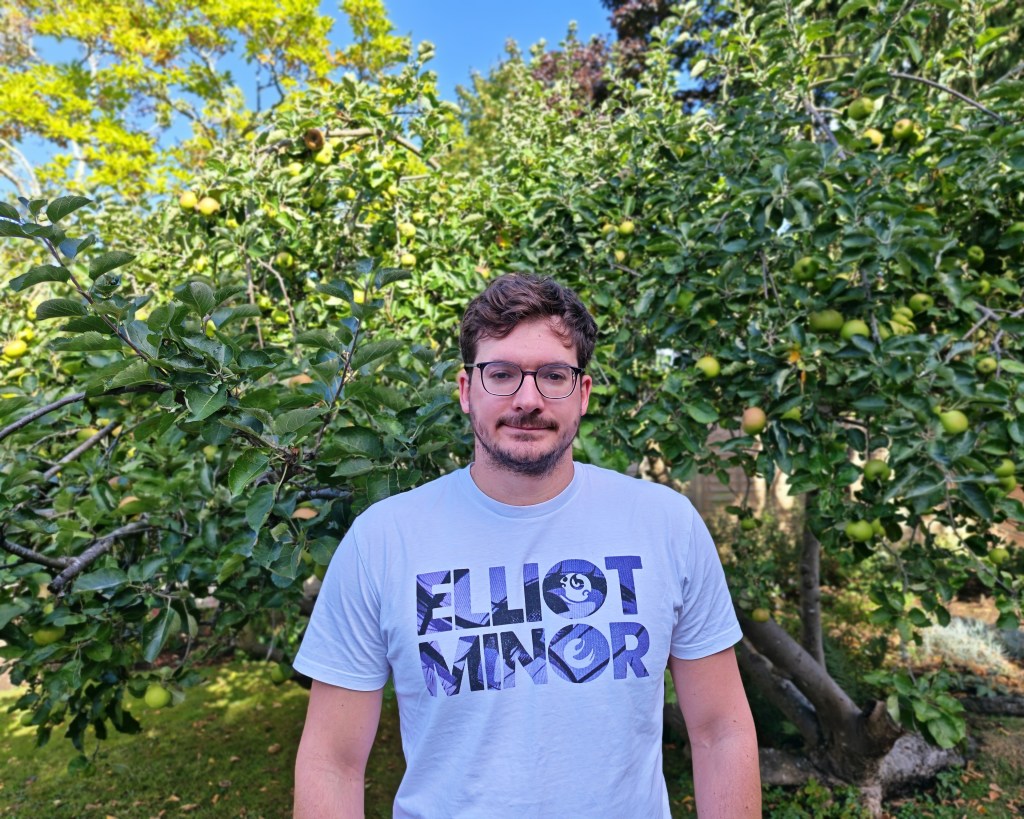 portrait of a man wearing a band tshirt 