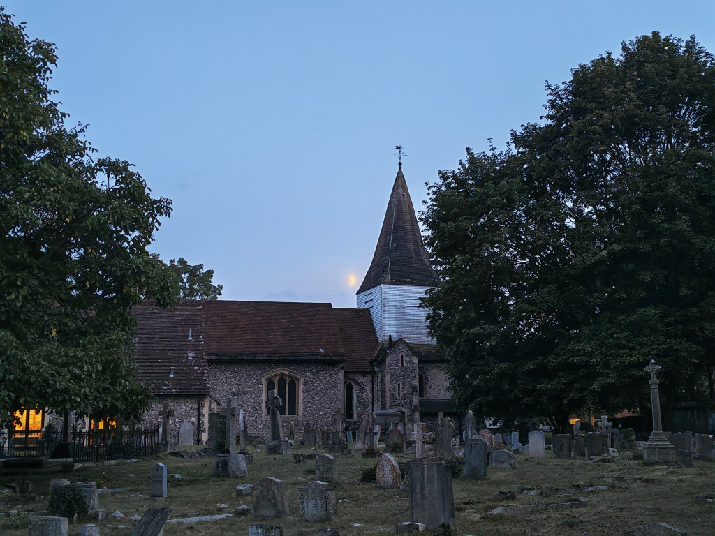 cemetery and church in low light