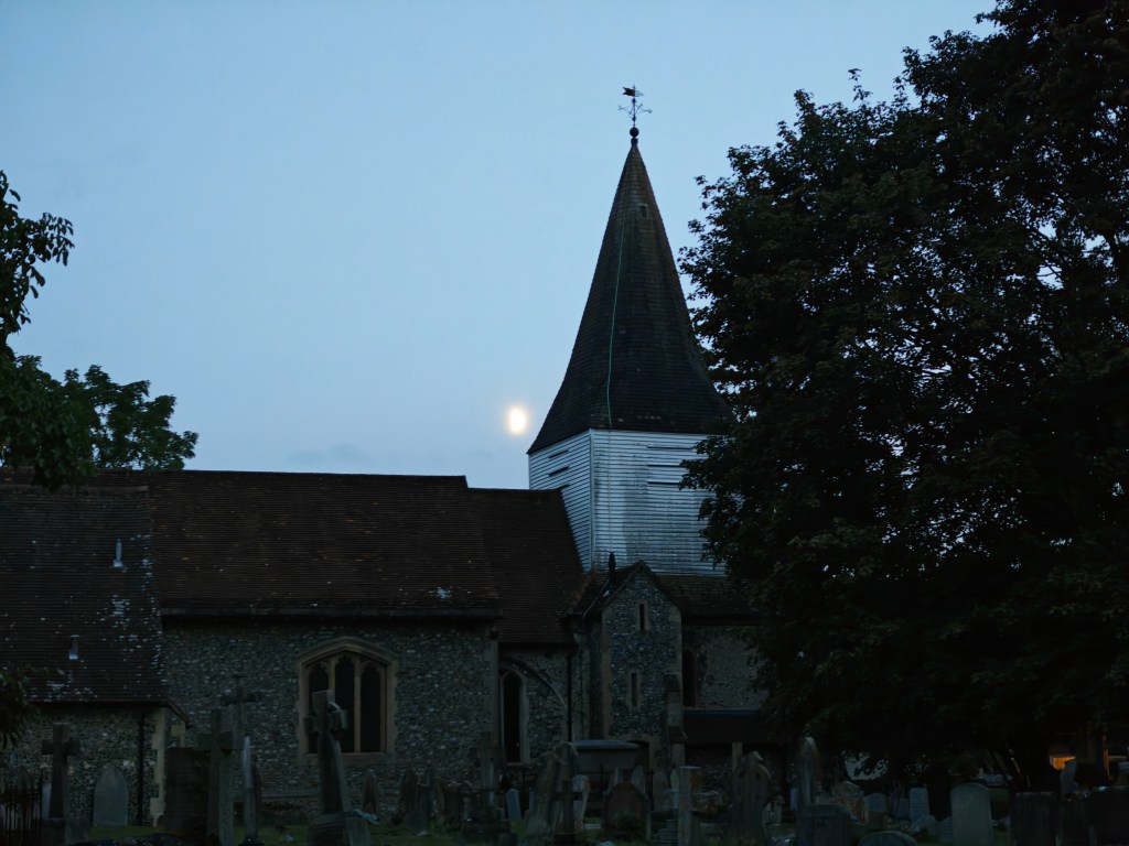 cemetery and church in low light