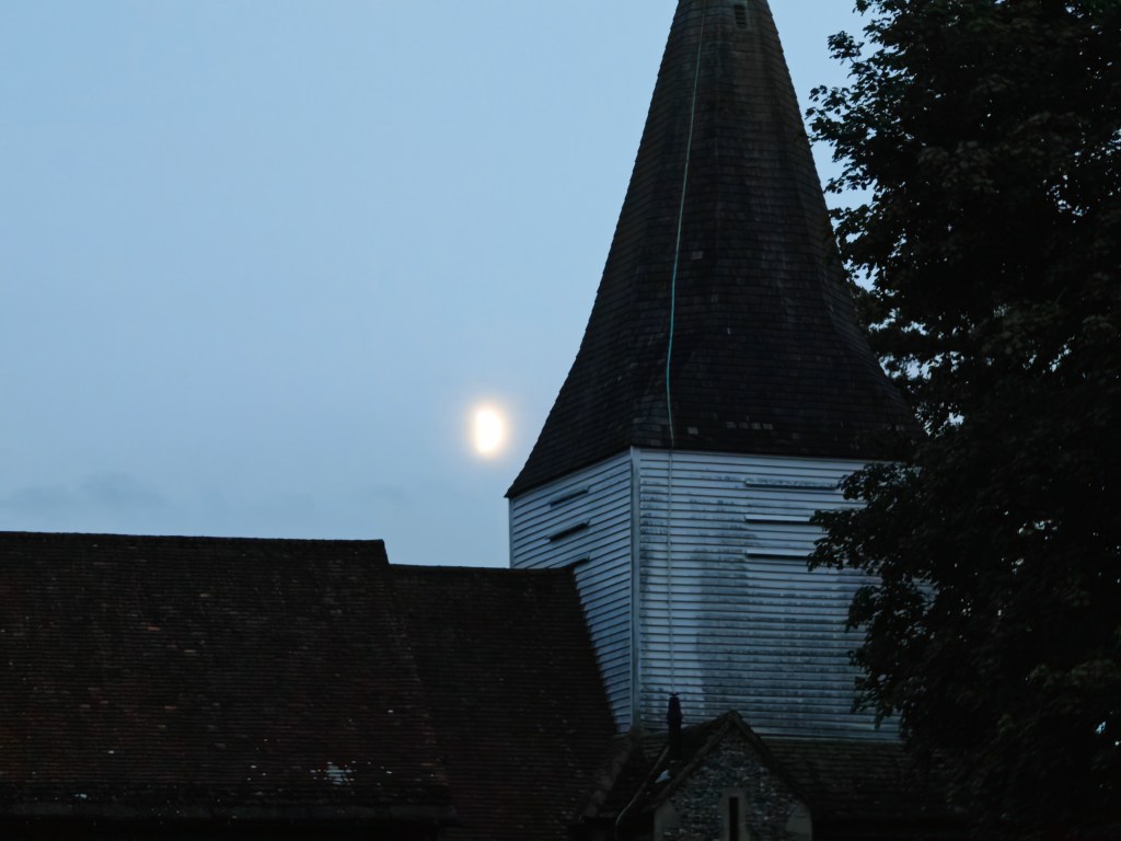 cemetery and church in low light