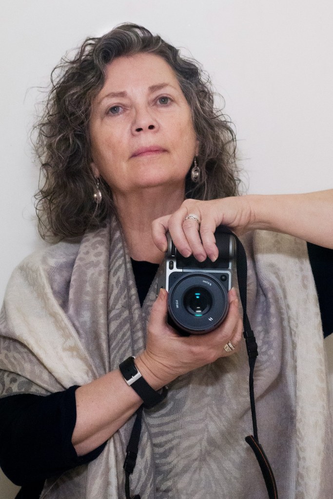 Jill Furmanovsky. Self portrait with Hasselblad X1D Dec 2018 by Jill Furmanovsky. Credit: Jill Furmanovsky Archive. SINGLE USE ONLY