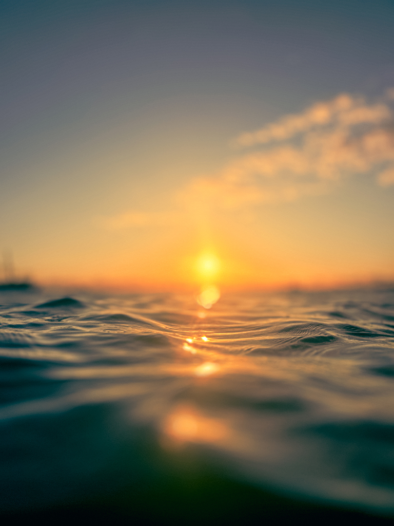 sunset over the sea on a bright spring afternoon in Salvador, Brazil, surrounded by the calm waters of All Saints Bay. 