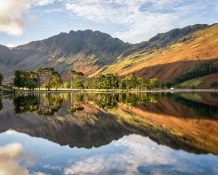 landscape reflection of lake buttermere in autumn