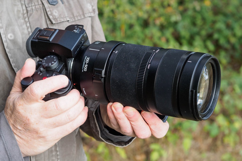 Panasonic Lumix S 100-500mm F5-7.1 OIS in-hand.