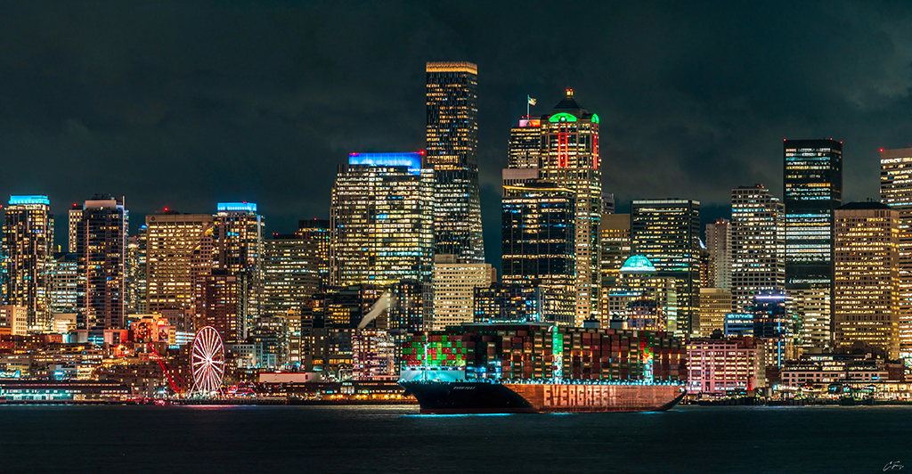 seattle skyline at night with buildings lit up