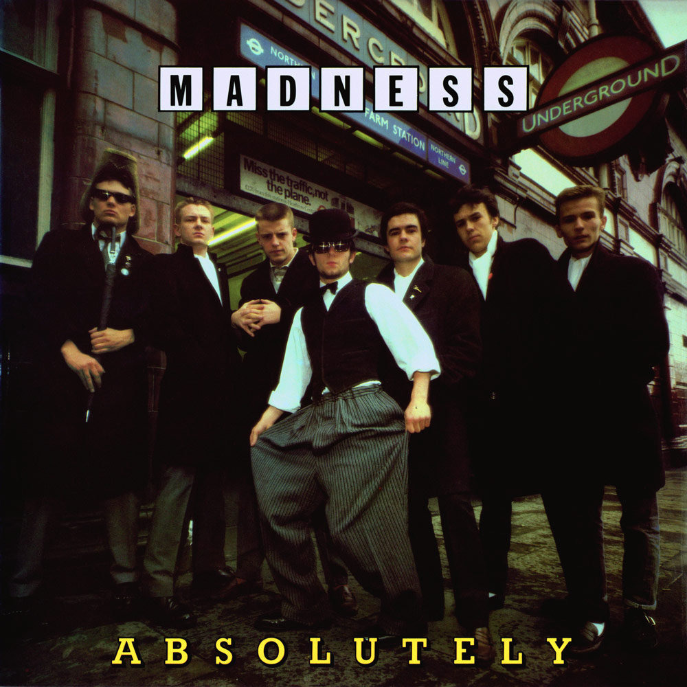 The second Madness album, Absolutely (1980), featured a more conventional colour photograph of the band on its front cover. This original version of it was later changed to a less sombre image. Credit: Stiff Records. SINGLE USE ONLY