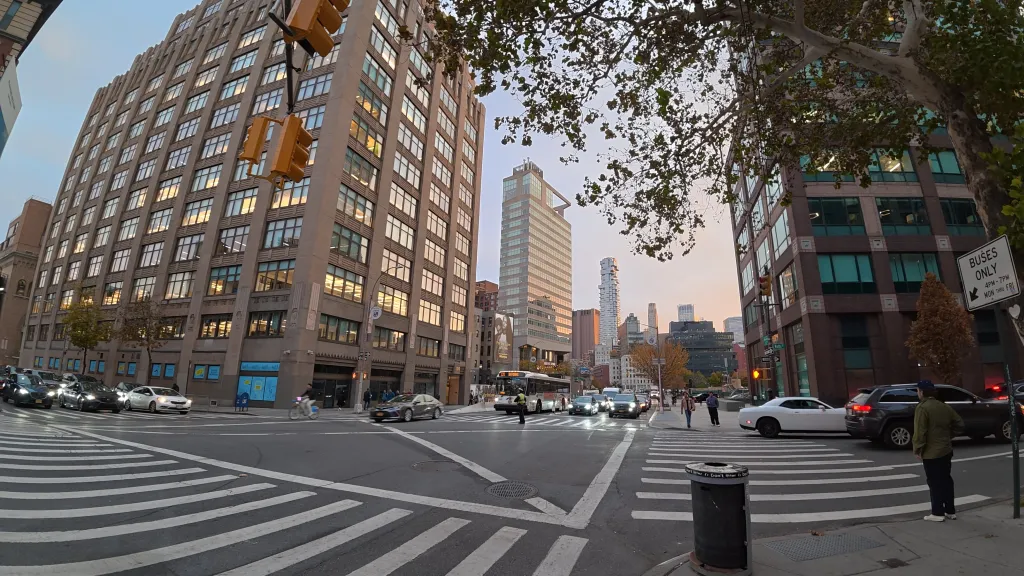 Sample image from the DJI Osmo Action 6, showing a New York crosswalk at sunset.