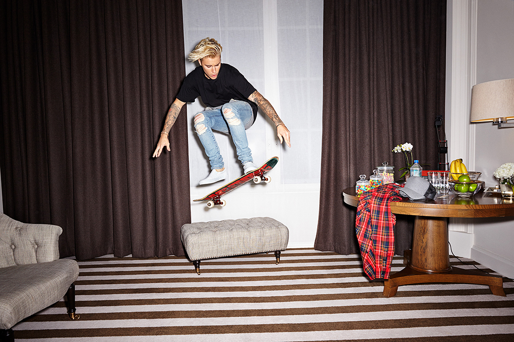 justin bieber on a skateboard mid-air