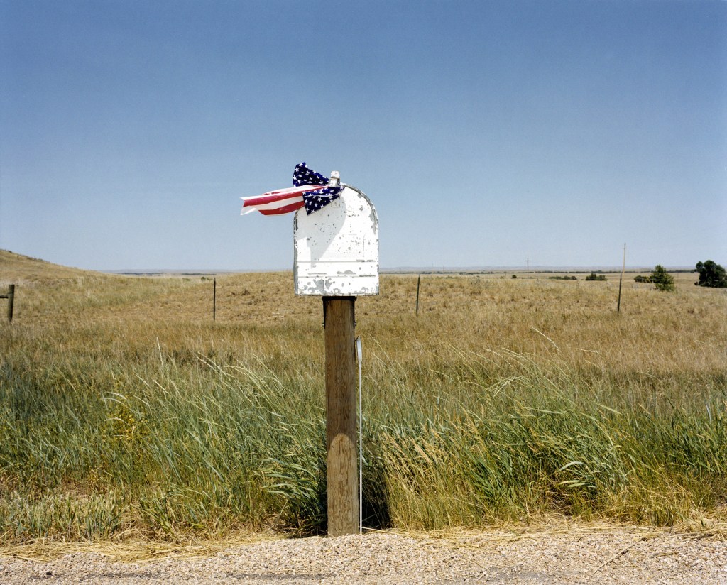 Post box on Highway 212, Faith, South Dakota, USA, 2002. Image Credit: Peter Dench