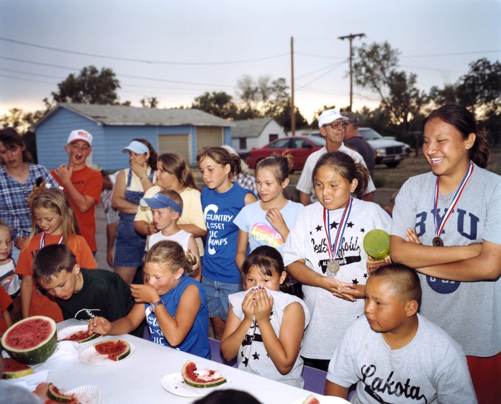 The watermelon eating competition was followed by the watermelon seed spitting competition, Faith, South Dakota, USA. Image Credit: Peter Dench