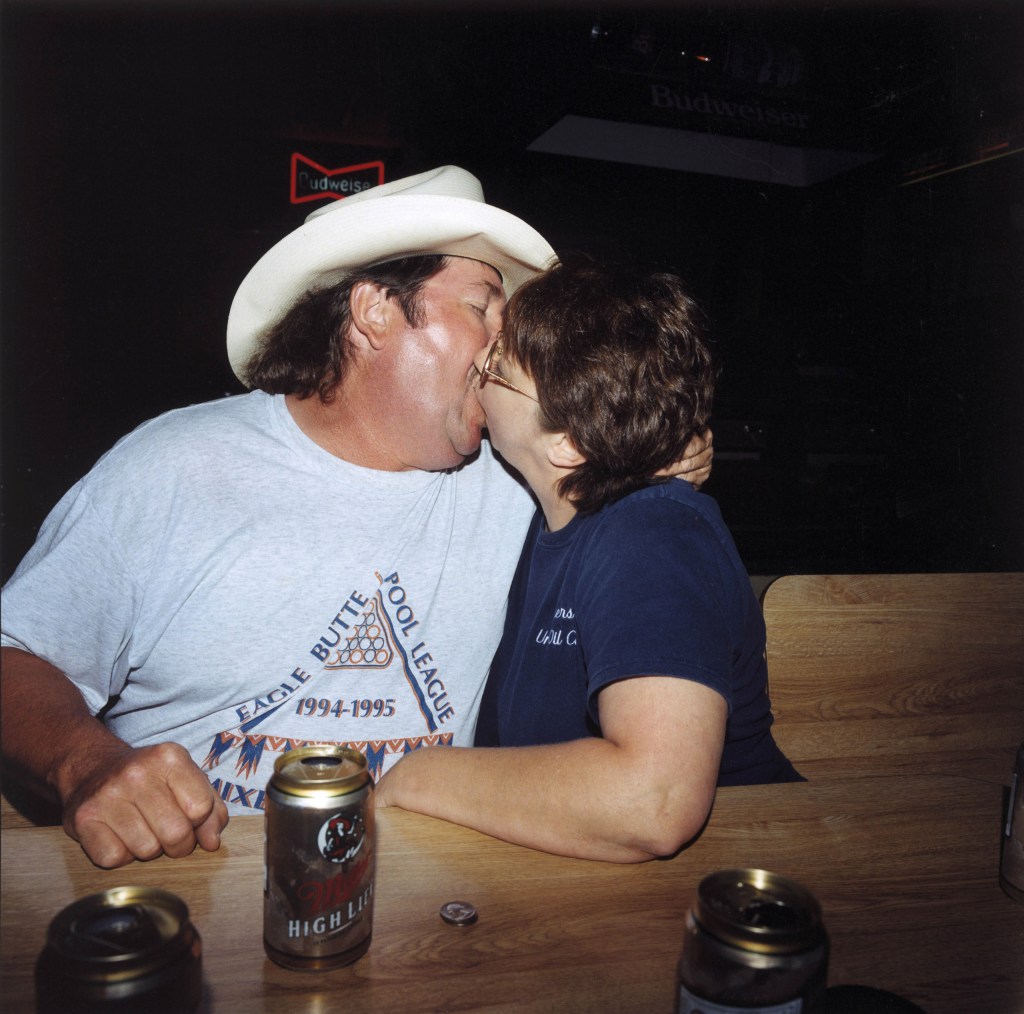 Tim with company at The Lone Tree Bar, Faith, South Dakota, USA. Image Credit: Peter Dench