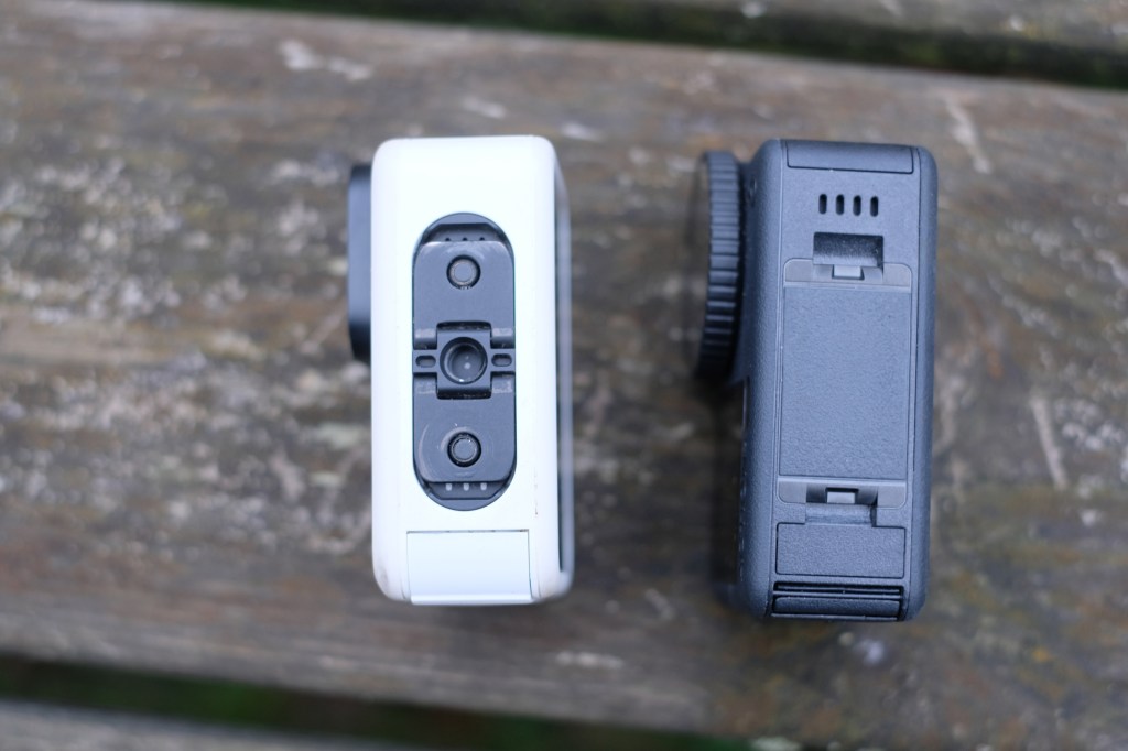 Photograph of GoPro Hero 13 Black and DJI Osmo Action 6 bottom, showing tripod thread on the GoPro