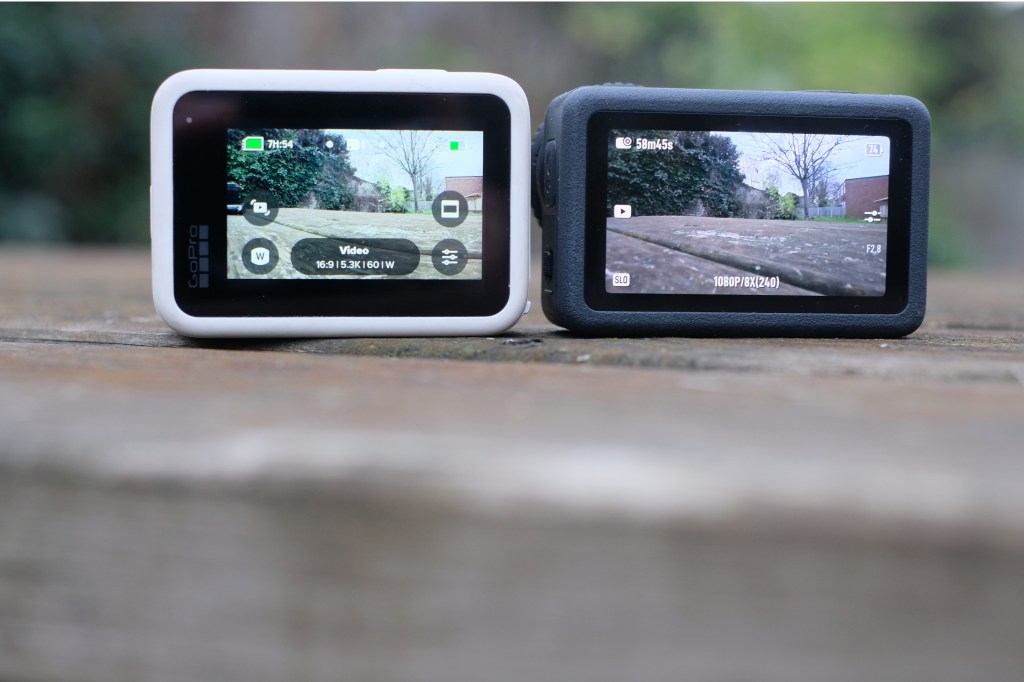 Photograph of GoPro Hero 13 Black and DJI Osmo Action 6 rear screens; the DJI screen is larger