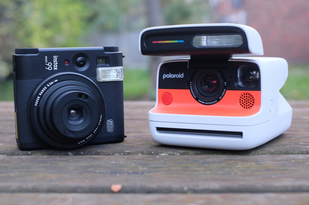Photograph of Polaroid Flip and Instax Mini 99 instant cameras