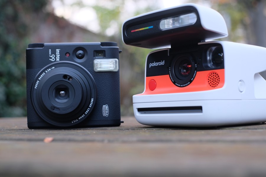 Photograph of Polaroid Flip and Instax Mini 99 instant cameras