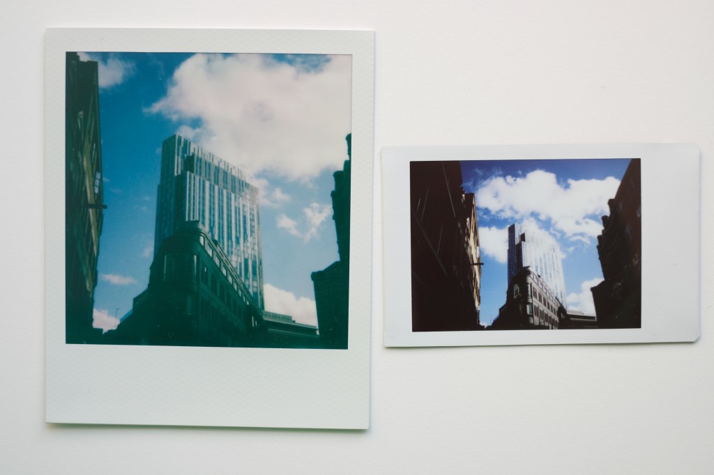 Polaroid and Instax Mini photograph of a building side by side