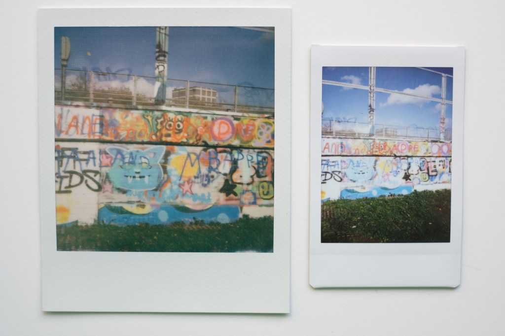 Instax and Polaroid images side by side showing wall covered in grafitti