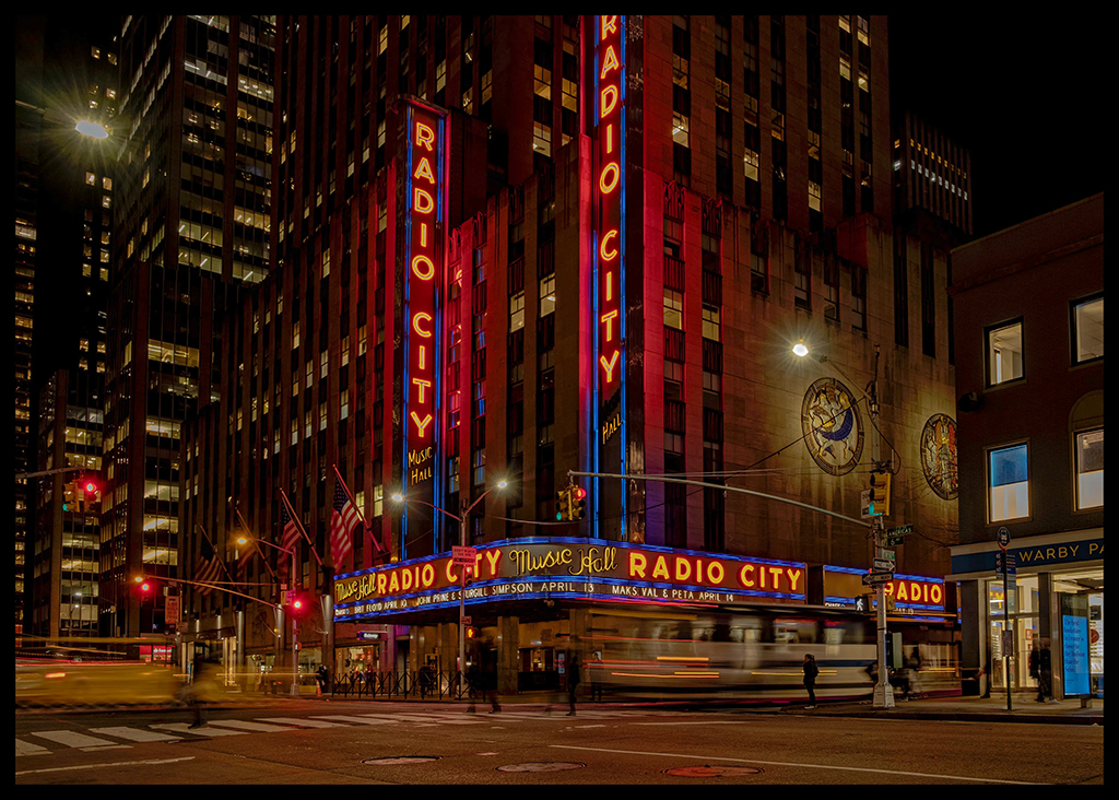 street corner in new york with neon lights lit