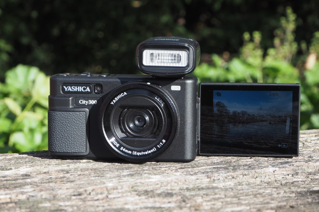 Yashica City 300 compact camera front with LCD flipped forward