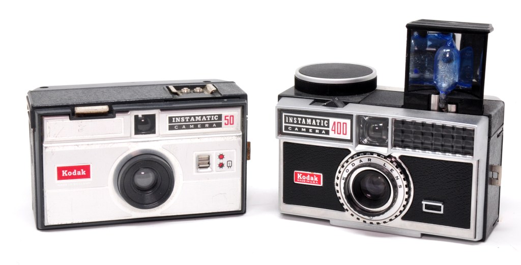 Compass camera with Compass sheet film, roll film and the camera’s purpose-made roll film back