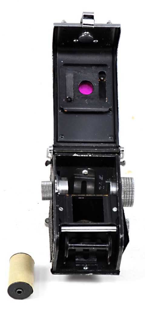 Inside the subminature Gemflex with a roll of its 17.5mm film