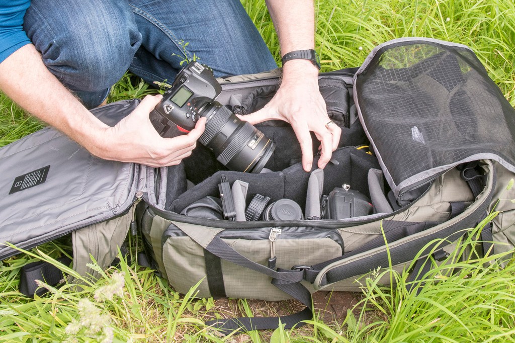 camera backpack with multiple lenses and camera