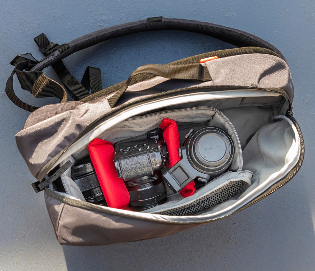shoulder bag with two lenses and a camera body