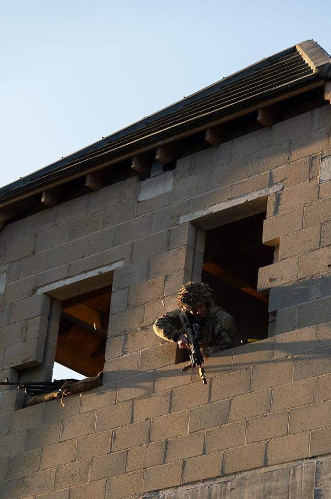 soldier leaning out a window