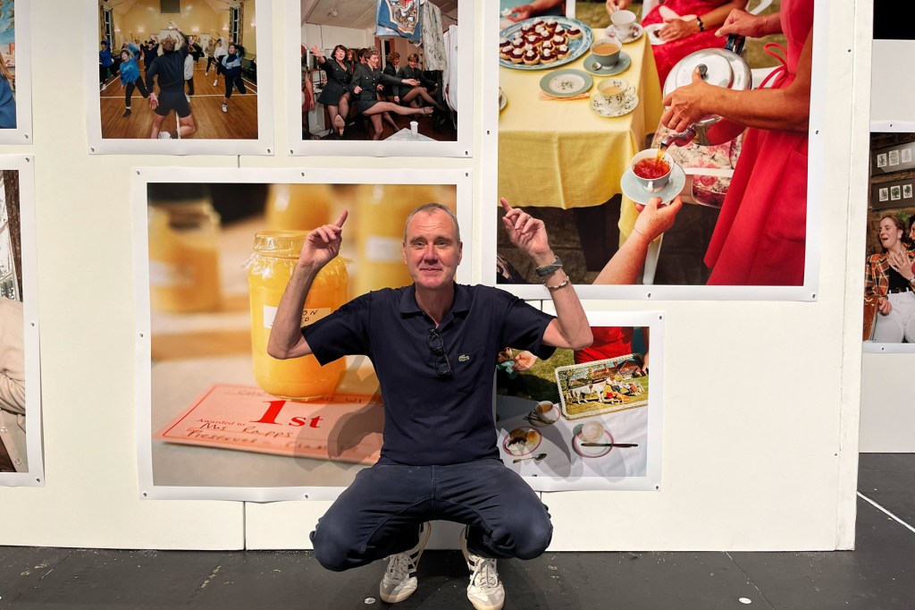 Peter Dench with Martin Parr's Chew Stoke exhibition at the 2024 Photo North Festival.