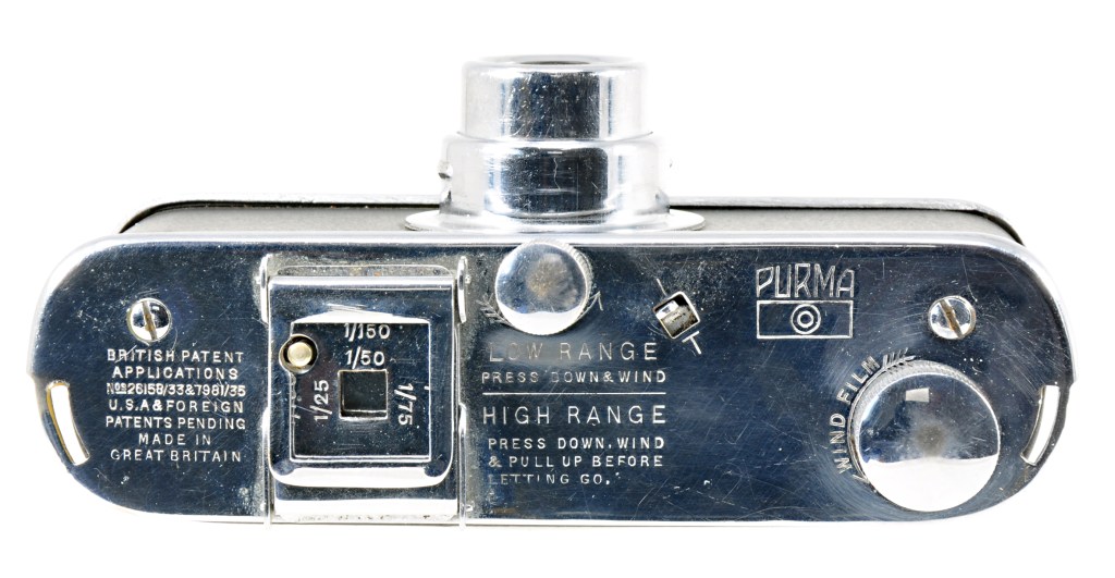 The neat (and slightly scratched) top plate of the camera adds engraved instructions on how to use the shutter