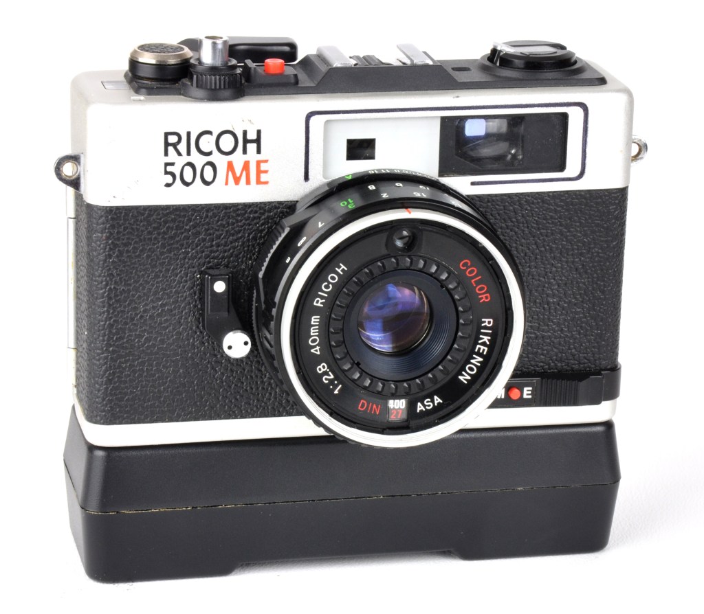 Ricoh 500ME with its clockwork-driven accessory motor drive in place on the base