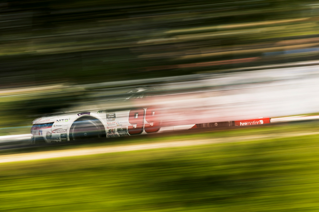 long exposure photo of a race car moving