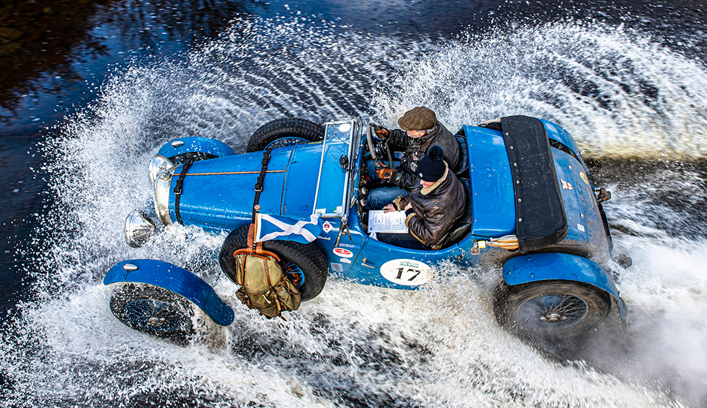 photograph of a blue run speeding through water