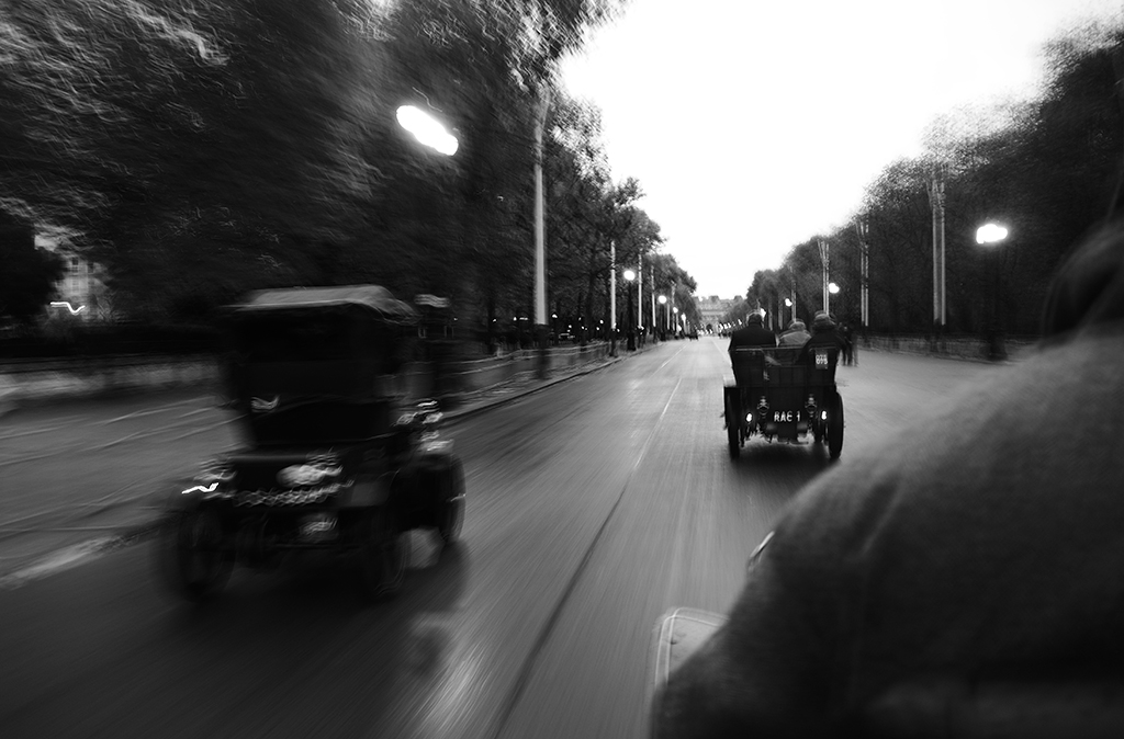 black and white motion photo of cars driving