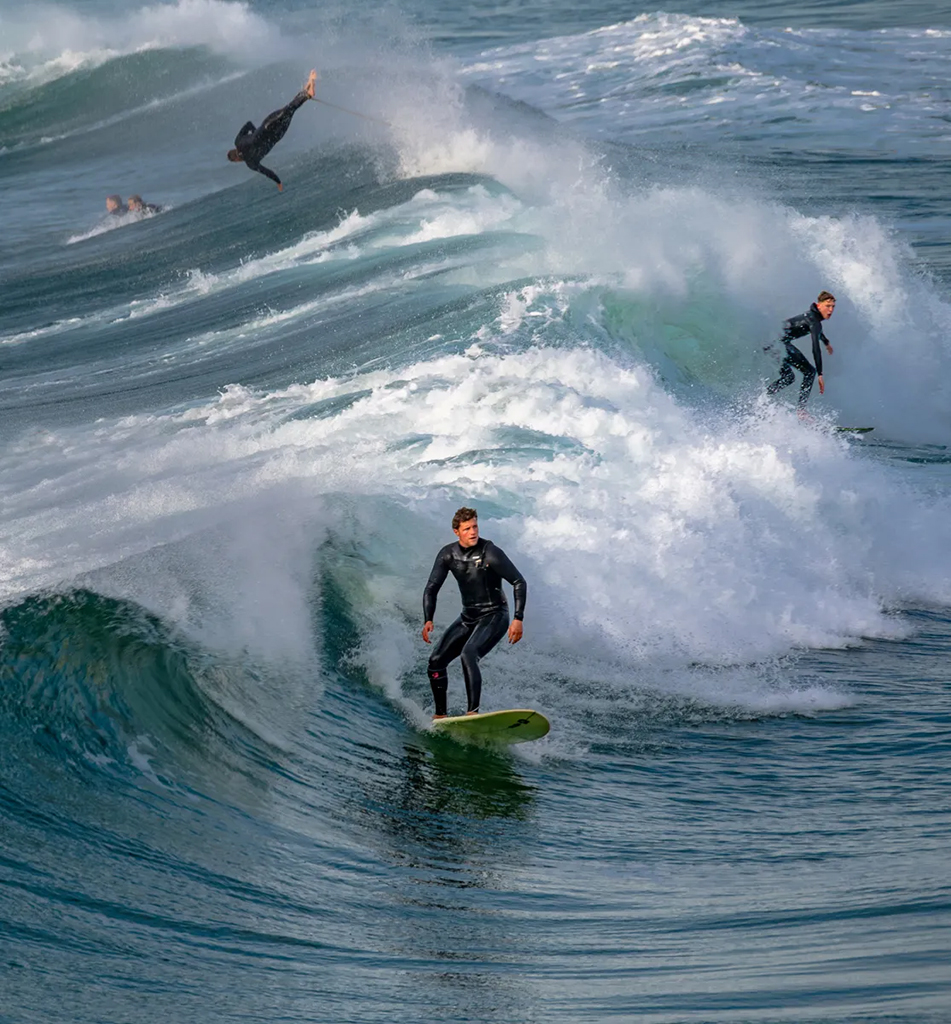 surfers in action in the waves