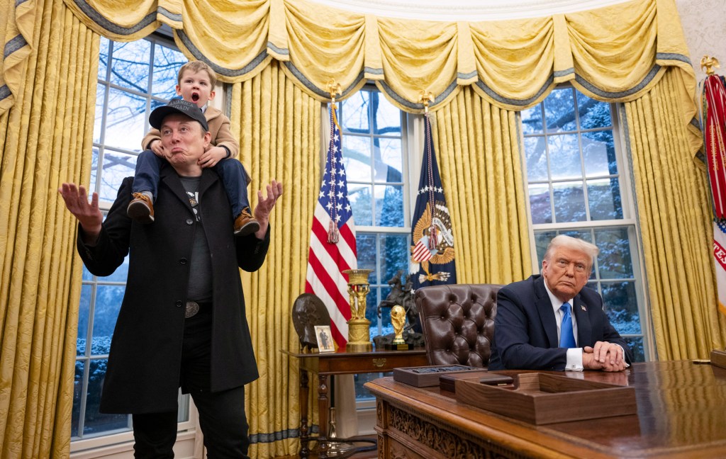 Tesla and SpaceX CEO Elon Musk with his son X Æ A-Xii join US President Donald Trump as he signs executive orders in the Oval Office of the White House in Washington, DC, February 11, 2025. Tech billionaire Elon Musk, who has been tapped by President Donald Trump to lead federal cost-cutting efforts, said the United States would go "bankrupt" without budget cuts. Musk leads the efforts under the newly created Department of Government Efficiency (DOGE), and was speaking at the White House with Trump, who has in recent weeks unleashed a flurry of orders aimed at slashing federal spending. (Photo by Jim WATSON / AFP via Getty Images)
