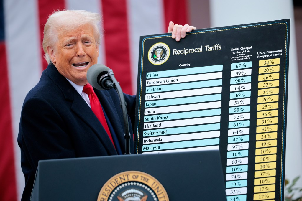 WASHINGTON, DC - APRIL 02: U.S. President Donald Trump holds up a chart while speaking during a “Make America Wealthy Again” trade announcement event in the Rose Garden at the White House on April 2, 2025 in Washington, DC. Touting the event as “Liberation Day”, Trump is expected to announce additional tariffs targeting goods imported to the U.S. (Photo by Chip Somodevilla/Getty Images)