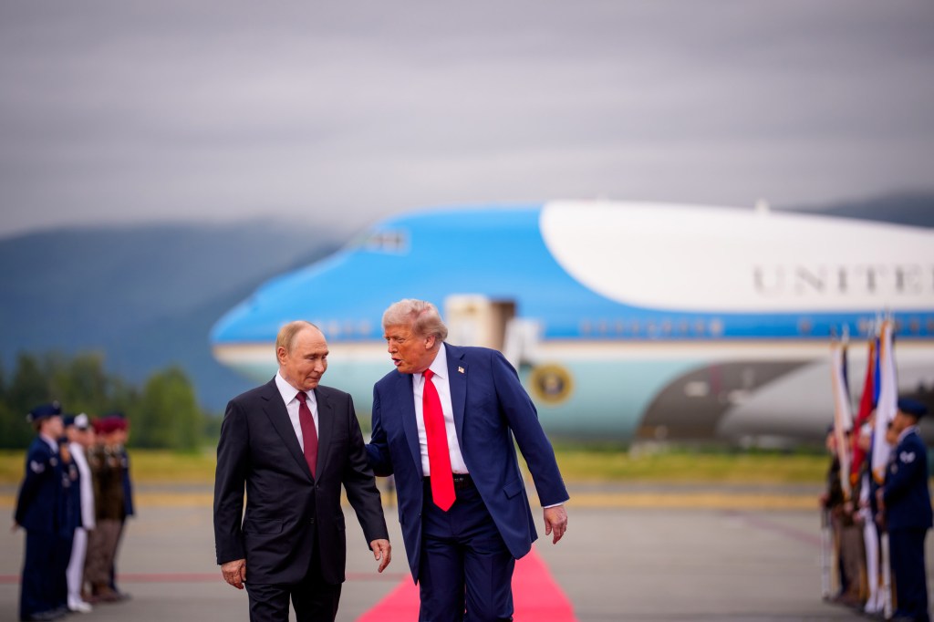 ANCHORAGE, ALASKA - AUGUST 15: U.S. President Donald Trump (R) greets Russian President Vladimir Putin as he arrives at Joint Base Elmendorf-Richardson on August 15, 2025 in Anchorage, Alaska. The two leaders are meeting for peace talks aimed at ending the war in Ukraine. (Photo by Andrew Harnik/Getty Images)