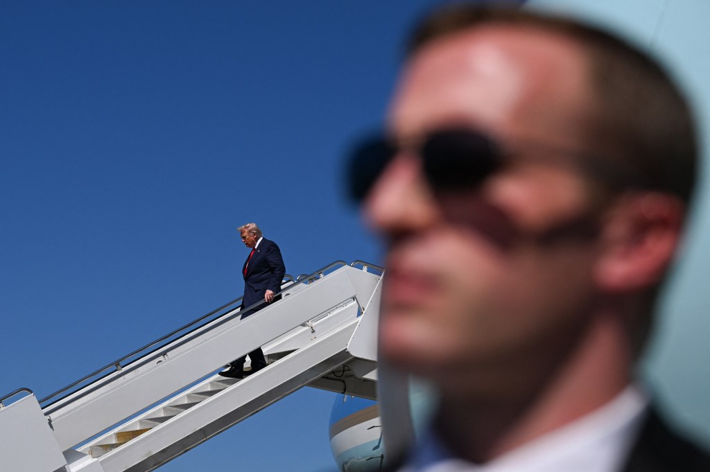 WEST PALM BEACH, FLORIDA - OCTOBER 31: US President Donald Trump exits Air Force One upon arrival at Palm Beach International Airport in West Palm Beach, Florida, on October 31, 2025. Trump is traveling to his Mar-a-Lago Florida residence for the weekend. (Photo by ROBERTO SCHMIDT / AFP) (Photo by ROBERTO SCHMIDT/AFP via Getty Images)        