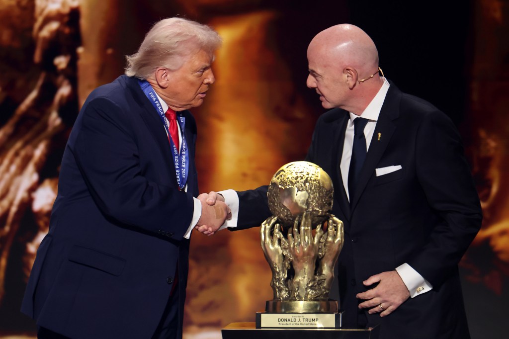 WASHINGTON, DC - DECEMBER 05: U.S. President Donald Trump receives the FIFA Peace Prize from Gianni Infantino, President of FIFA, during the FIFA World Cup 2026 Official Draw at John F. Kennedy Center for the Performing Arts on December 05, 2025 in Washington, DC. (Photo by Hector Vivas - FIFA/FIFA via Getty Images)
