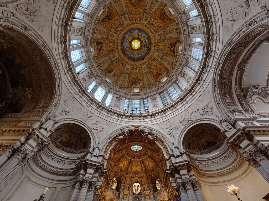 inside a cathedral looking up at the dome