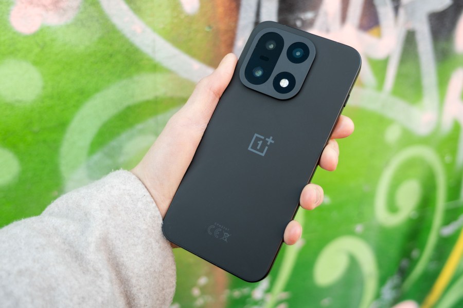 The OnePlus 15 in hand.