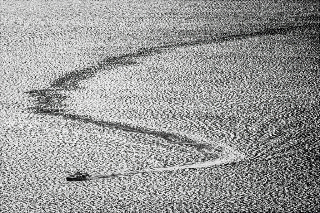 boat creating s shape in water