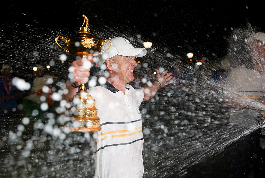 golfer justin rose being sprayed by champagne at the ryder cup
