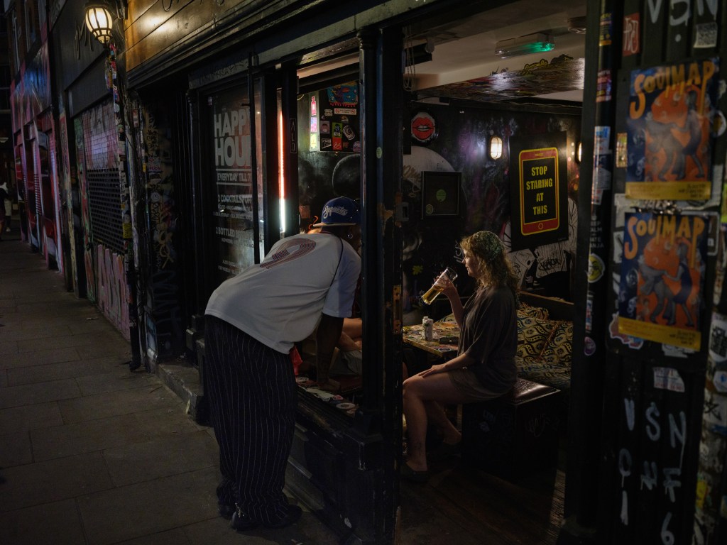 Trying to have a quiet drink. Brick Lane, London, UK. July 10, 2025. Photo: Edmond Terakopian