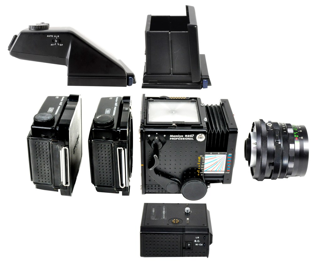 Mamiya RZ67 Professional broken down: body, standard lens, 120 and 220 roll film backs, waist-level and prism viewfinders and power winder that screws to the base