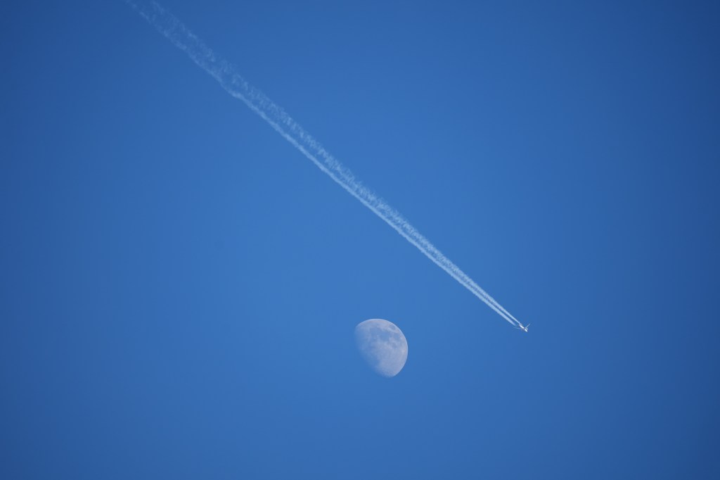 Sony A7 V moon and airplane sample image