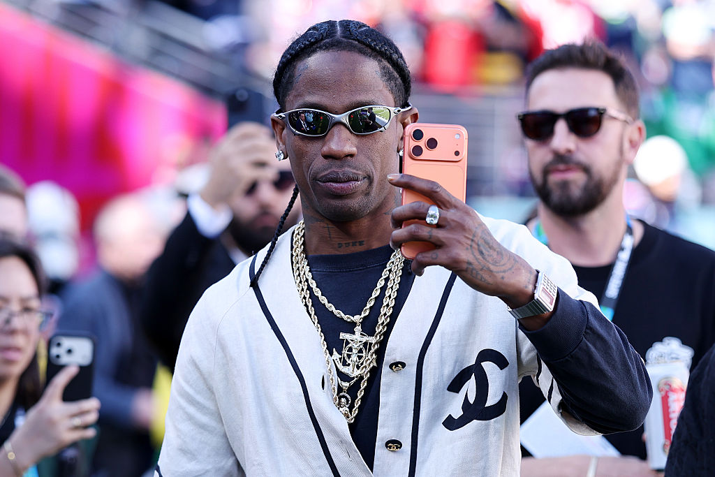 SANTA CLARA, CALIFORNIA - FEBRUARY 08: Travis Scott is seen on the sidelines prior to the start of Super Bowl LX between the Seattle Seahawks and the New England Patriots at Levi's Stadium on February 08, 2026 in Santa Clara, California. (Photo by Kevin C. Cox/Getty Images)