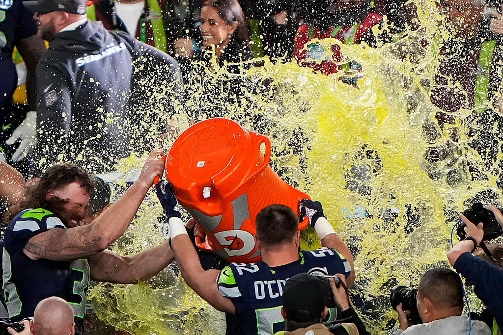 SANTA CLARA, CALIFORNIA - FEBRUARY 08: Head coach Mike MacDonald of the Seattle Seahawks is doused with Gatorade by Brady Russell #38 of the Seattle Seahawks and Patrick O'Connell #52 of the Seattle Seahawks after beating New England Patriots 29-13 to win Super Bowl LX at Levi's Stadium on February 08, 2026 in Santa Clara, California. (Photo by Thearon W. Henderson/Getty Images)